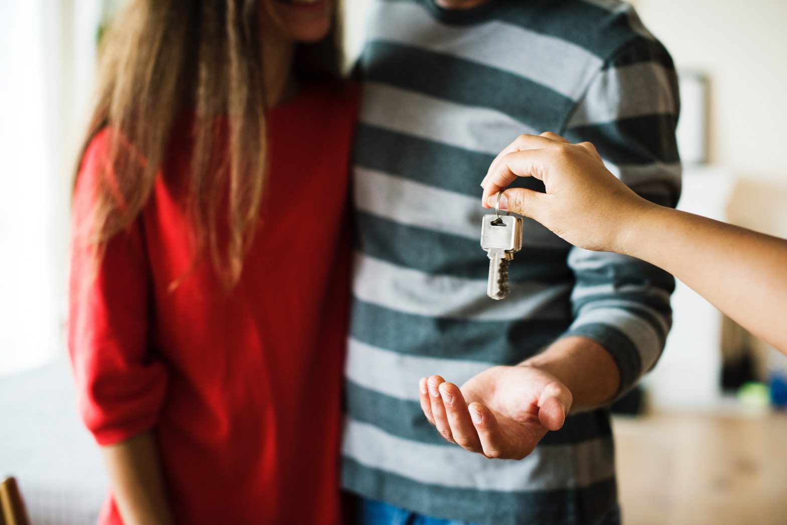A couple is getting the keys of their new house